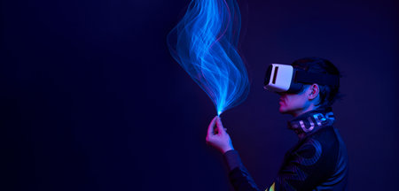 Man is using virtual reality headset to access in metaverse.の写真素材