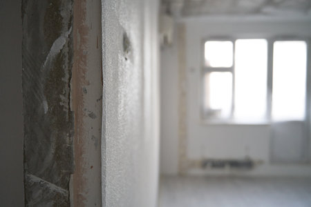 Interior of a new apartment without finishing in gray tones.の写真素材