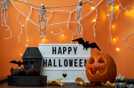 Happy Halloween white sign with black letters, pumpkin and halloween decoration.の写真素材