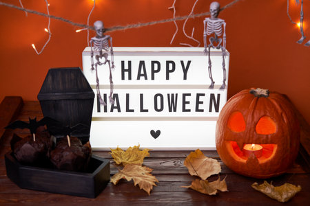 Happy Halloween white sign with black letters, pumpkin and halloween decoration.の写真素材