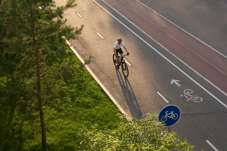 Man bicycling on cycling road. Top aerial view.の写真素材