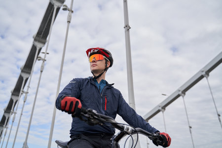 Portrait of a cyclist man against the background of the city.の写真素材