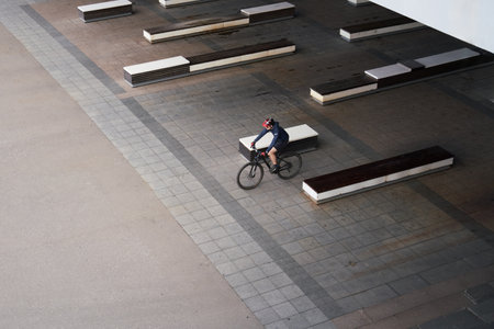 Man riding on bicycle in the city. View from above.の写真素材