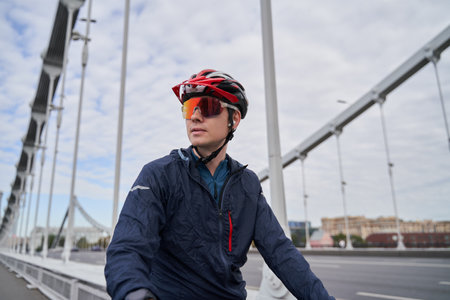 Portrait of a cyclist man against the background of the city.の写真素材