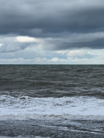 Stormy ocean with dark clouds and rough wavesの写真素材