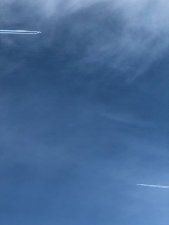 Two Airplanes Flying in Clear Blue Sky