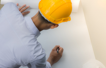 Architect working on blueprint.engineer inspector  in workplace - architectural project, High angle view,blueprint ,Construction concept.の写真素材