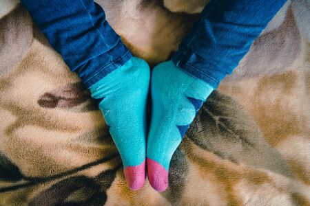 Woman showing her feet with her stockings during quarantine