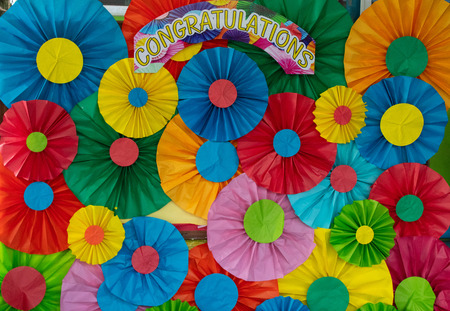 Colored paper folded into a circular background.
