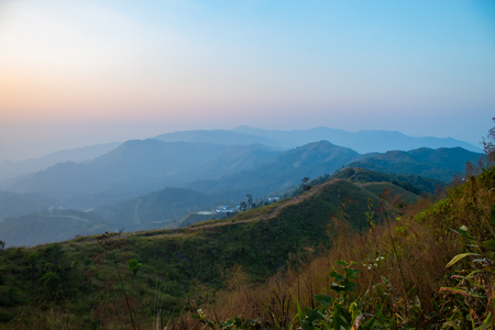 Light sunset behind the mountains Nern Chang Suek  hills, Kanchanaburi, Thailandの写真素材
