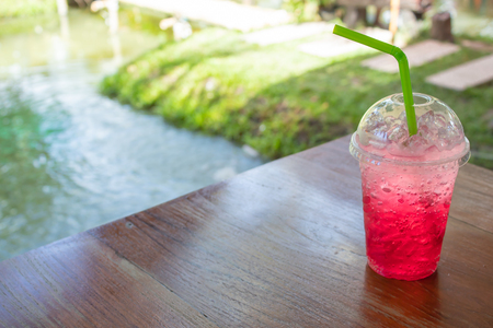 Red soda cold thirst in garden.の写真素材