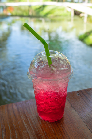 Red soda cold thirst in garden.の写真素材