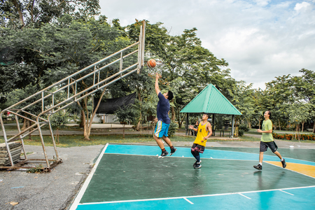 Bang Yai , Nonthaburi , Basketball player of Philippine and Thai, playing basketball for health in the morning at the park. 10 June 2018のeditorial素材