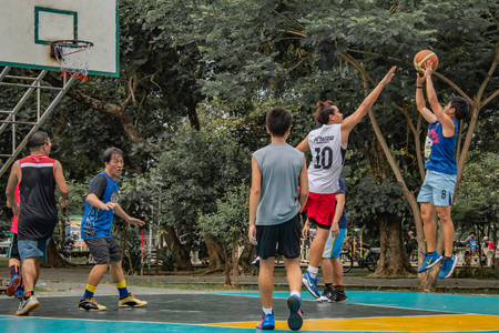 Bang Yai , Nonthaburi , Basketball player of Philippine and Thai, playing basketball for health in the morning at the park. 10 June 2018のeditorial素材