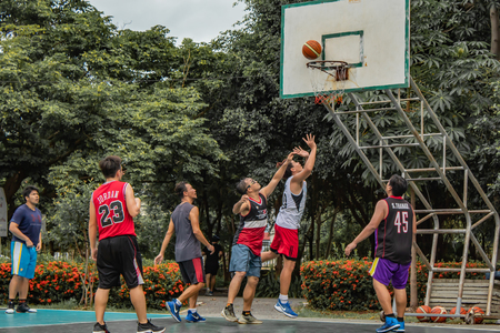 Bang Yai , Nonthaburi , Basketball player of Philippine and Thai, playing basketball for health in the morning at the park. 10 June 2018のeditorial素材