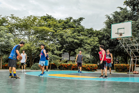 Bang Yai , Nonthaburi , Basketball player of Philippine and Thai, playing basketball for health in the morning at the park. 10 June 2018のeditorial素材