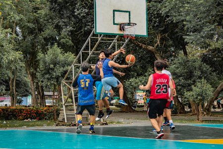 Bang Yai , Nonthaburi , Basketball player of Philippine and Thai, playing basketball for health in the morning at the park. 10 June 2018のeditorial素材