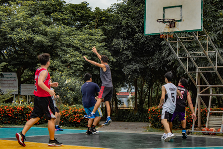 Bang Yai , Nonthaburi , Basketball player of Philippine and Thai, playing basketball for health in the morning at the park. 10 June 2018のeditorial素材