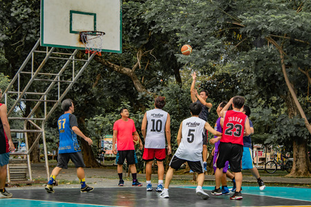 Bang Yai , Nonthaburi , Basketball player of Philippine and Thai, playing basketball for health in the morning at the park. 10 June 2018のeditorial素材