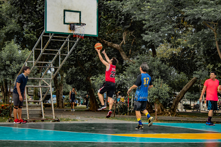 Bang Yai , Nonthaburi , Basketball player of Philippine and Thai, playing basketball for health in the morning at the park. 10 June 2018のeditorial素材