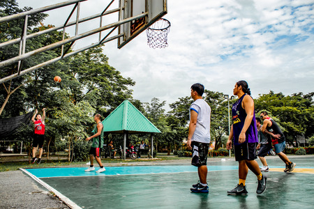 Bang Yai , Nonthaburi , Basketball player of Philippine and Thai, playing basketball for health in the morning at the park. 10 June 2018のeditorial素材