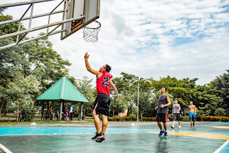 Bang Yai , Nonthaburi , Basketball player of Philippine and Thai, playing basketball for health in the morning at the park. 10 June 2018のeditorial素材