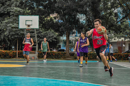 Bang Yai , Nonthaburi , Basketball player of Philippine and Thai, playing basketball for health in the morning at the park. 10 June 2018のeditorial素材