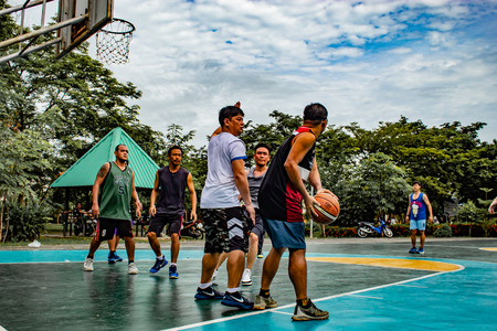 Bang Yai , Nonthaburi , Basketball player of Philippine and Thai, playing basketball for health in the morning at the park. 10 June 2018のeditorial素材
