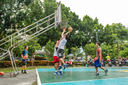 Bang Yai , Nonthaburi , Basketball player of Philippine and Thai, playing basketball for health in the morning at the park. 10 June 2018のeditorial素材