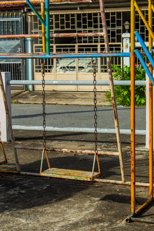 Swing chairs for children in park.の写真素材
