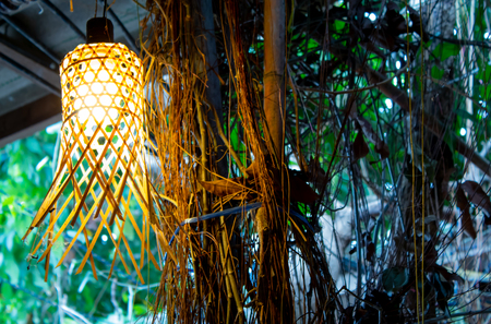 Light bulb in the bamboo weave.の写真素材