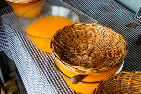 Fresh orange juice in a glass jar with a lid baskets.の写真素材