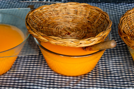 Fresh orange juice in a glass jar with a lid baskets.の写真素材