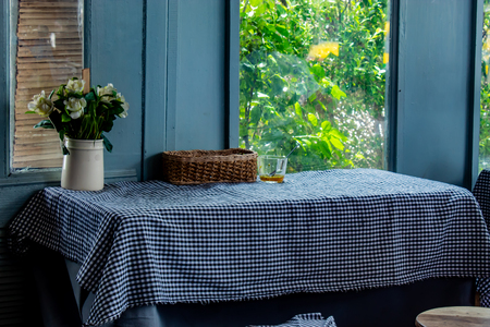The dining table, tablecloth and put a vase of flowers.の写真素材