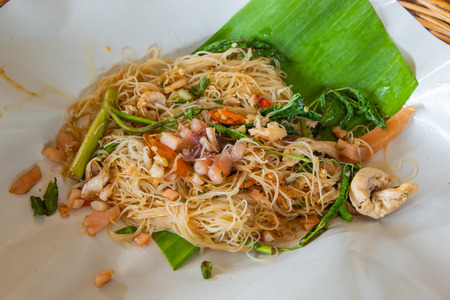 Rice noodle stir fry vegetables  on the banana leaves.の写真素材