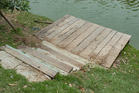 Wooden staircase down to the pondの写真素材