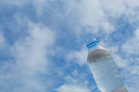 Drink water and bright blue sky.の写真素材