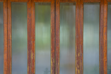 Glass door frame old wood.の写真素材