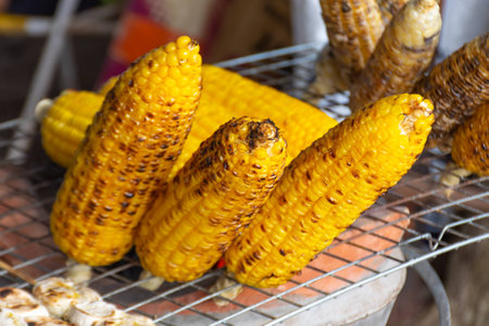 Corn roasted on charcoal in Thailand.