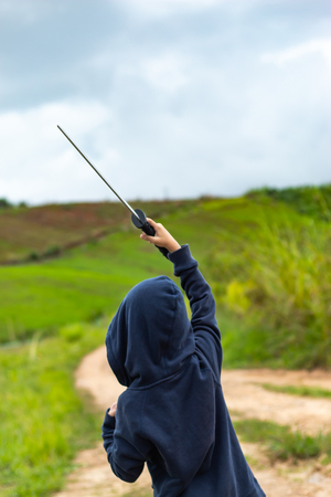 Portrait of a boy holding a wooden sword play.の写真素材