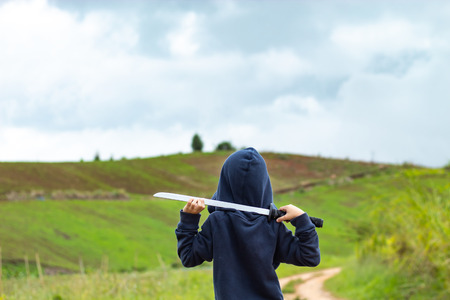 Portrait of a boy holding a wooden sword play.の写真素材