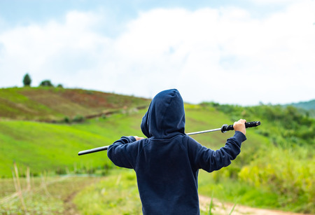 Portrait of a boy holding a wooden sword play.の写真素材