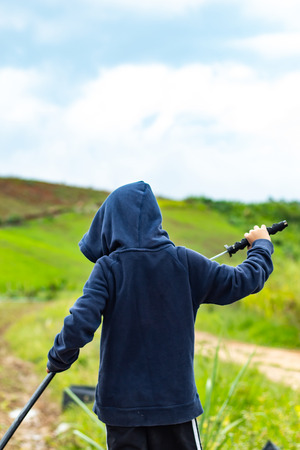 Portrait of a boy holding a wooden sword play.の写真素材