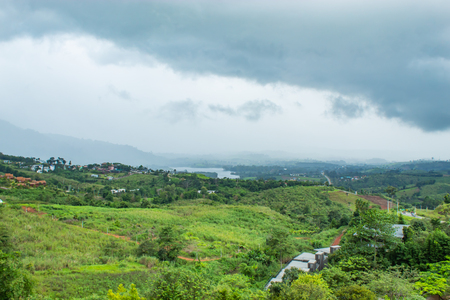 The rain that is falling on the mountains flows into the reservoir.の写真素材