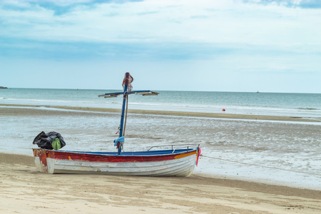 Wooden boat on the sand The seaside at Suan Pradipat in Prachuap Khiri Khan , Thailand.の写真素材