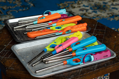 Gun lighter colors placed on the tray.の写真素材