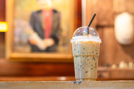 Iced coffee on a wooden table in the coffee shop.の写真素材