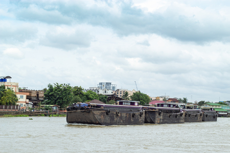 A boat load of sand in the Chao Phraya River , Thailandの写真素材