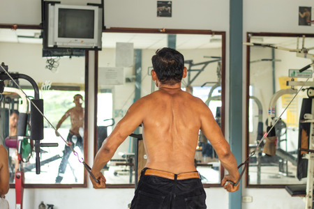 Men's Fitness Weight training in the gym.の写真素材