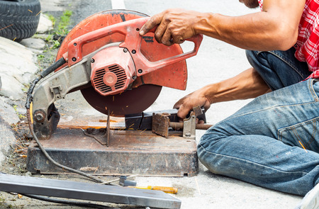 The workers are cutting steel. With steel cutting tools.の写真素材